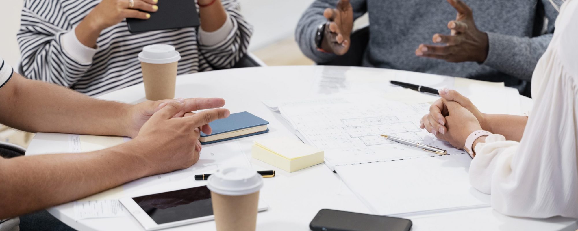 close-up-young-colleagues-having-meeting