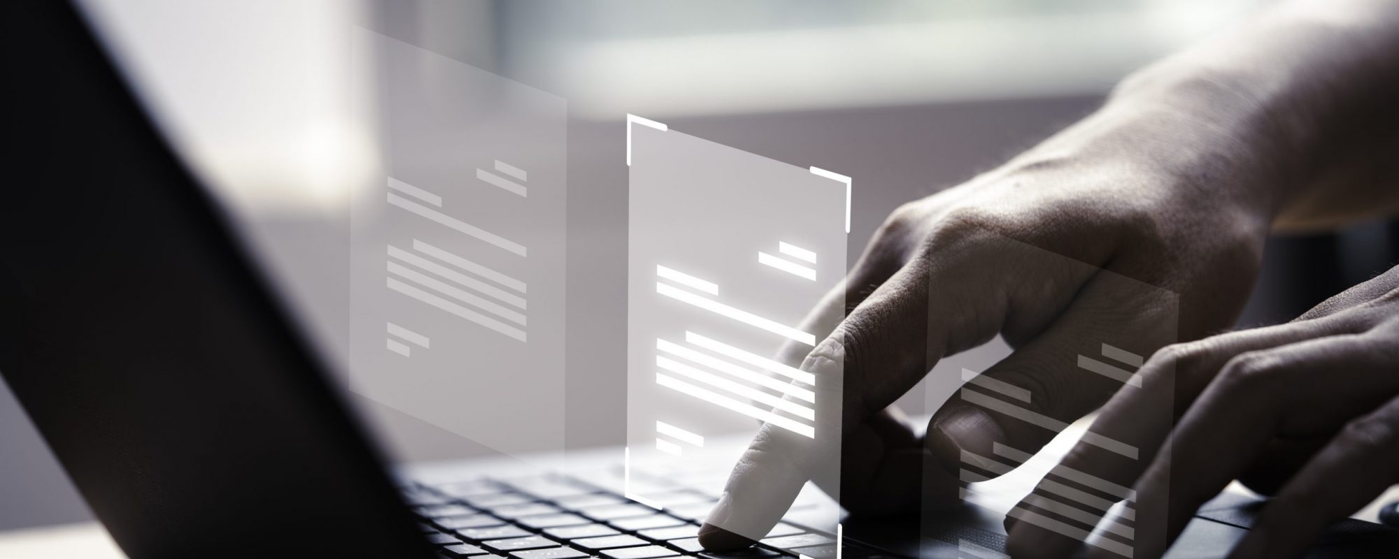 Hand using laptop computer with virtual screen and document for online approve paperless quality assurance and ERP management concept.